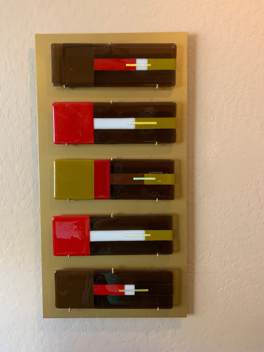 Set of five glass pieces in browns and red