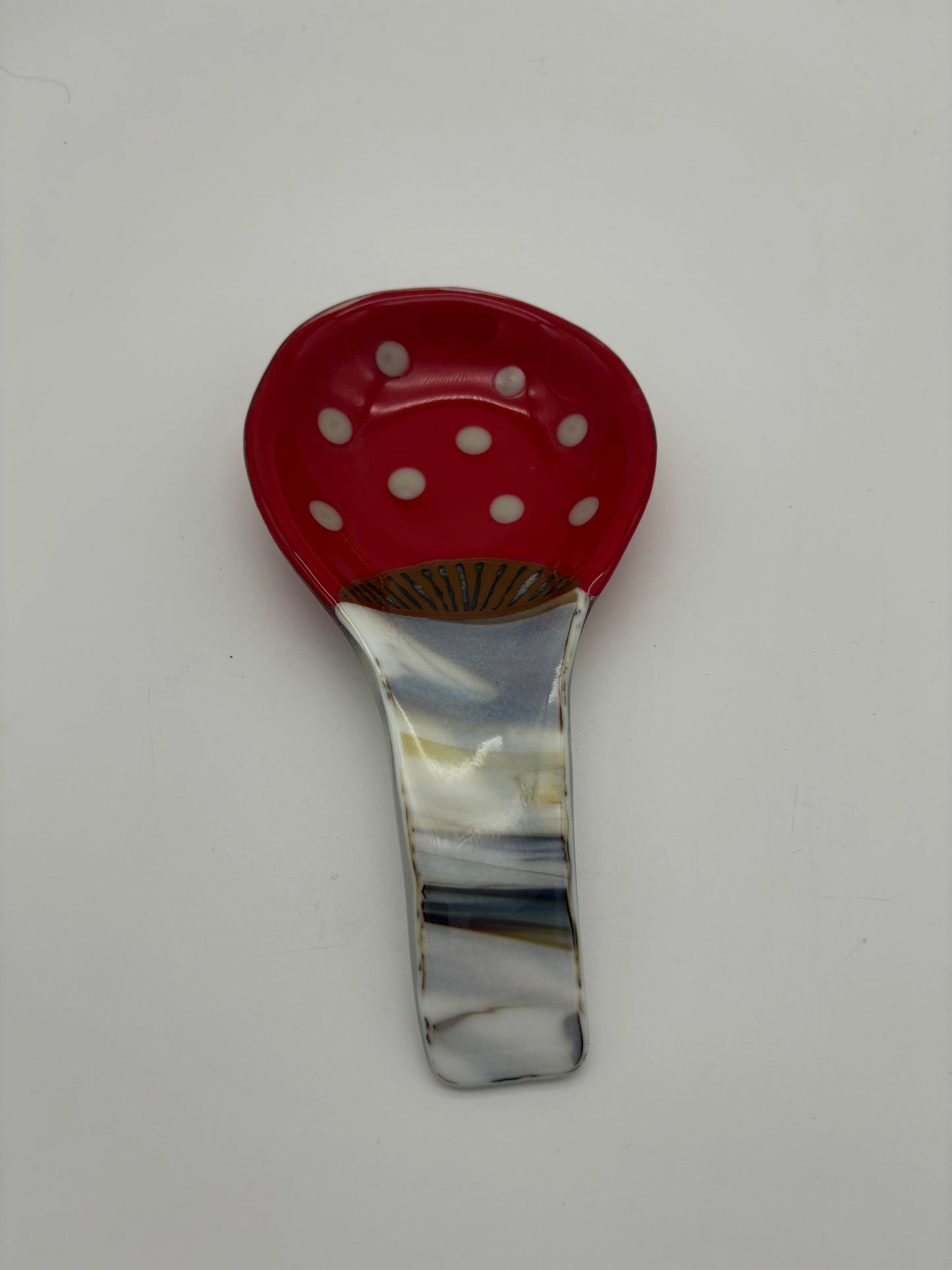 Brown and white streaky spoon rest with red dots